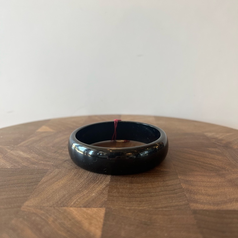 Antique Bakelite bracelet thinner width with 2 1/2” opening solid black